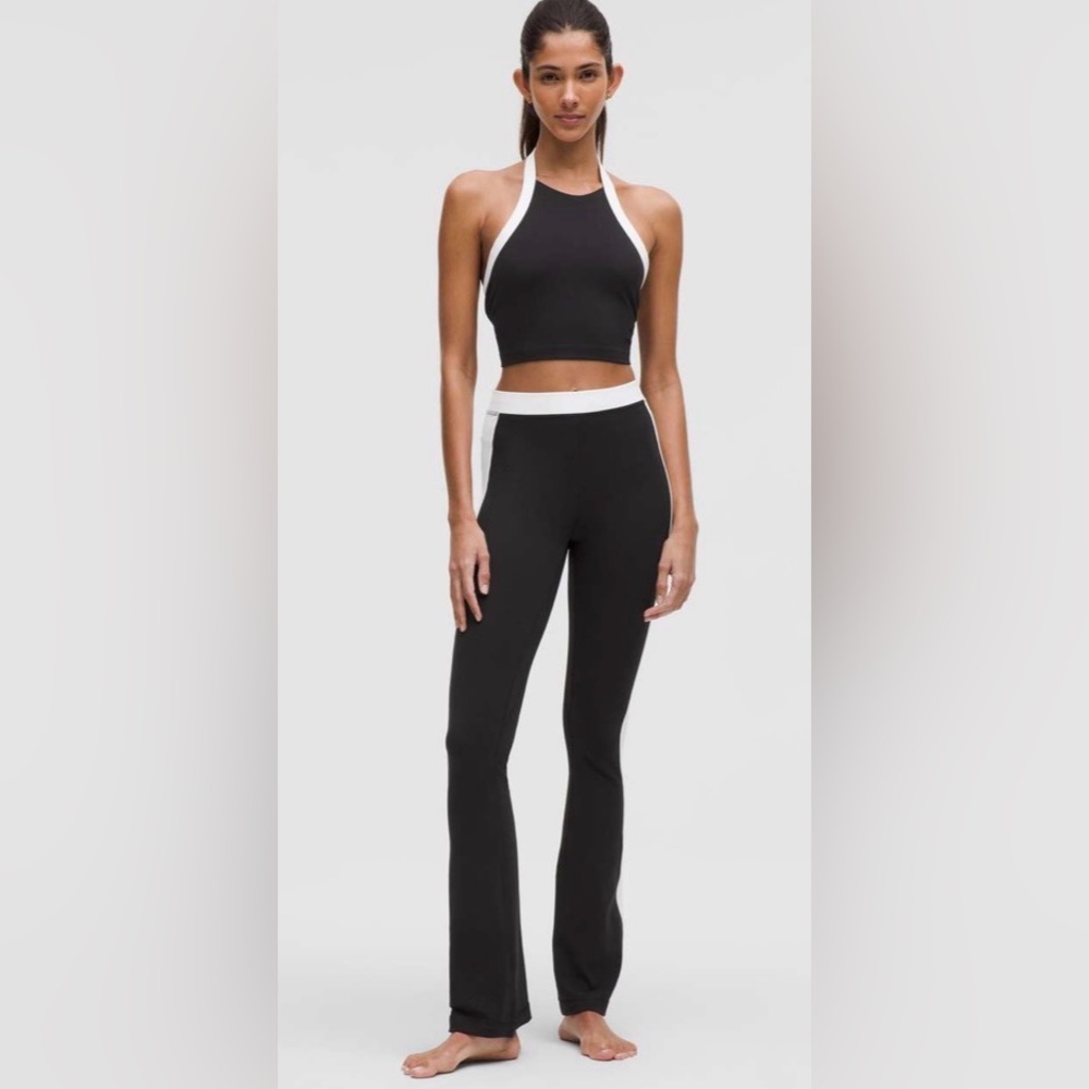 Lululemon Nulu HighRise Flared Pants in navy blue with white side stripes size 8